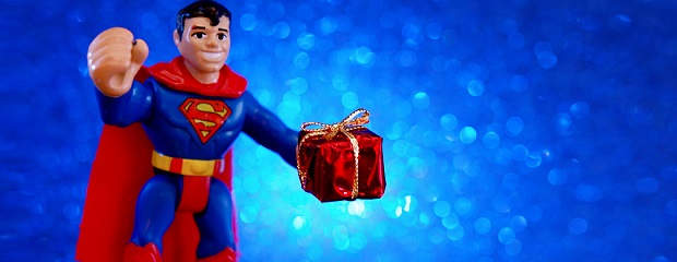 A toy Superman holding a present
