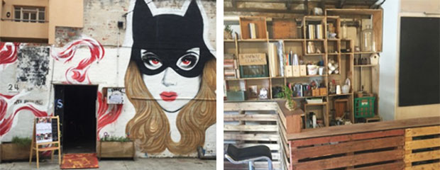 A photo of the cat woman graffiti on the outside of Laneway Learning Central and some artistic shelves behind the wooden bar inside the workshop
